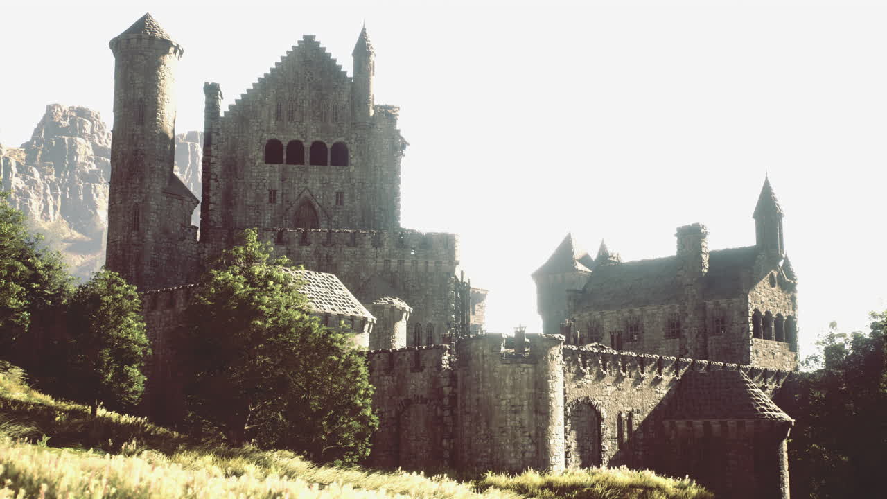 Ancient castle sits majestically on a hill surrounded by lush greenery
