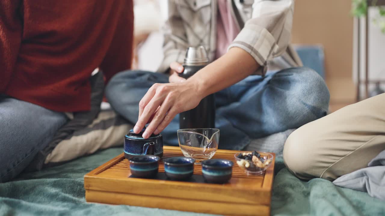 Friends Enjoying a Tea Ceremony at Home