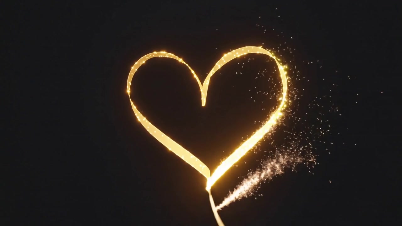 Tracing gold ribbon sweeping from lower-right spraying sparks, forming heart with S loop on black