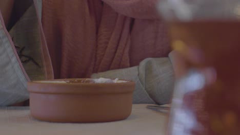 woman eating turkish dessert