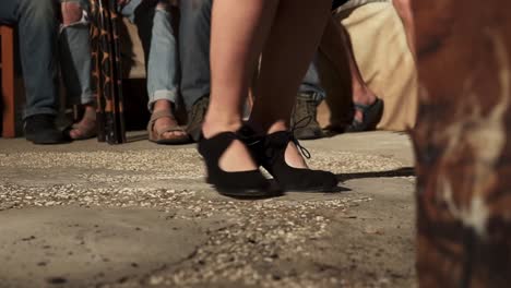 feet of a flamenco woman clicking to the rhythm