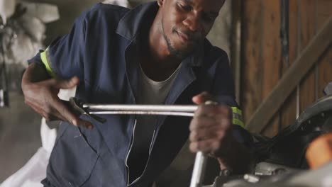 African-man-repairing-car