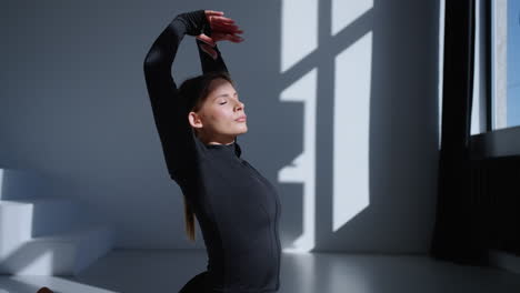 woman stretching in a gym