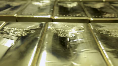 Stacked-gold-bars-in-a-bank,-close-up-slider-shot,-expensive,-concept-wealth