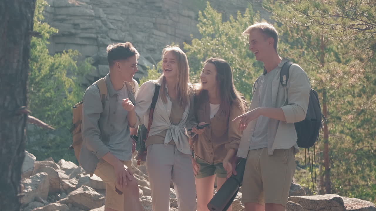 Young Friends Deciding Where to Go on Hike