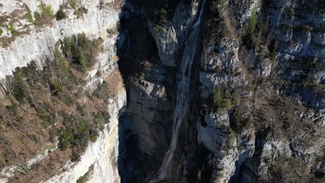 Amden-Weesen-Switzerland-scenic-waterfall-falls-down-the-cliff-in-the-Alps-tilt-down