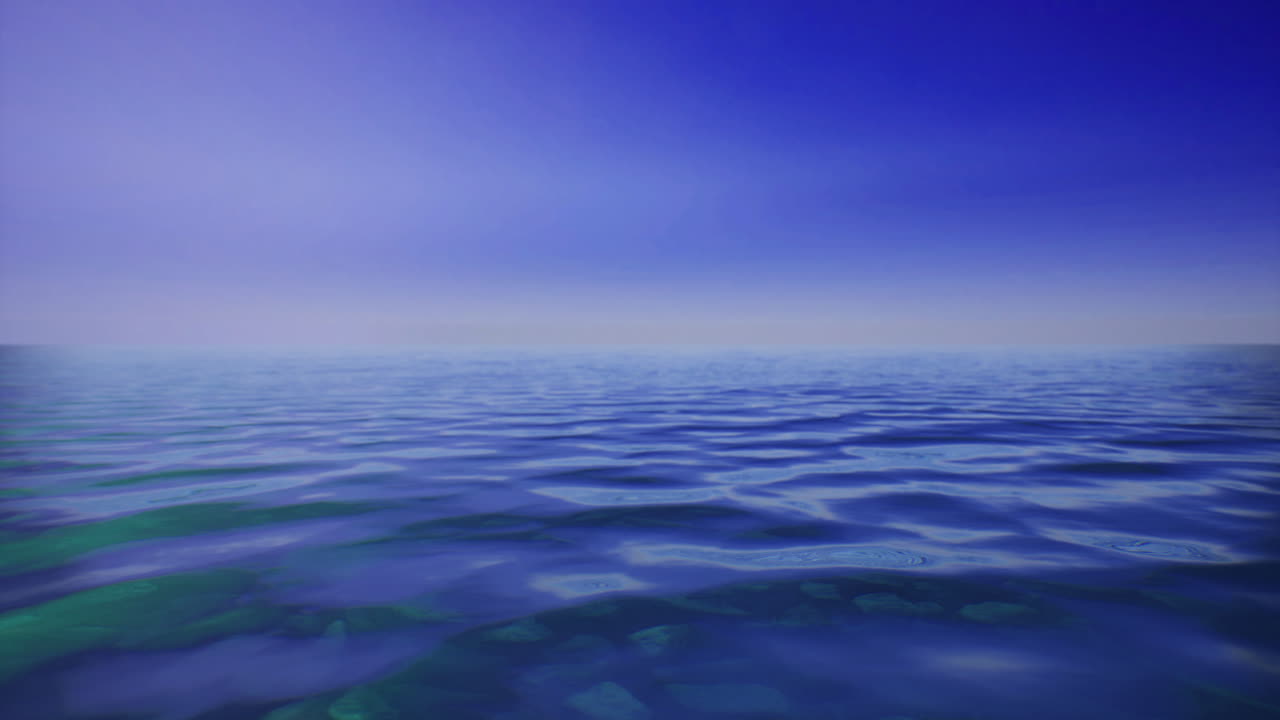 Endless blue horizon meets serene water under clear sky during calm day