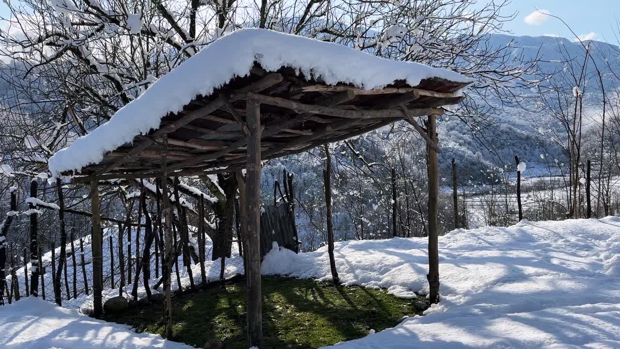 sunshade shelter in winter snow heavy snowfall in rural mountain forest iran sun hut in road parking local people handmade wooden structure in nature landscape village agriculture lifestyle country