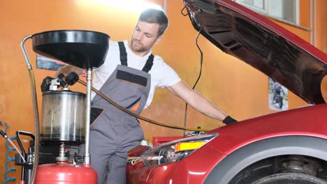 a mechanic working on a car engine in an auto repair shop