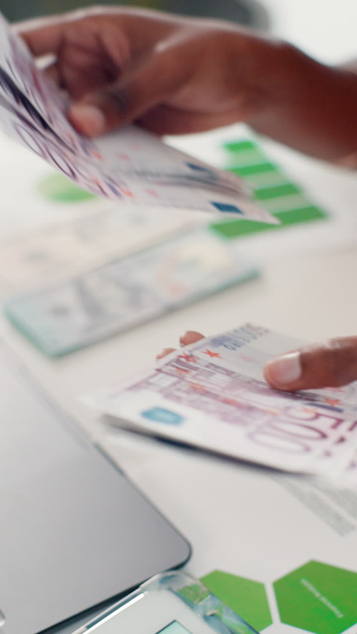 Close Up of Hands Counting 500 Euro Banknotes
