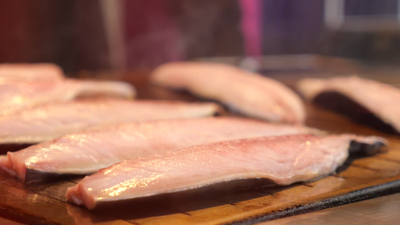 Fish fillets on a wooden board