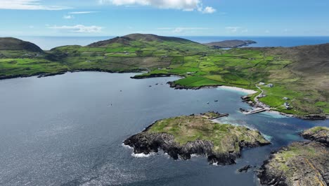 Drone-landscape-flying-over-island,little-fishing-harbour,to-beach-on-The-Beara-Peninsula-in-West-Cork-Ireland-a-road-trip-on-The-Wild-Atlantic-Way