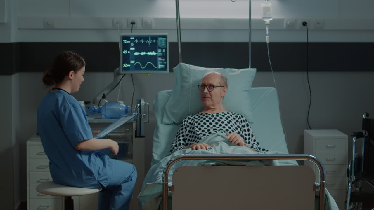 Sick patient talking to nurse about treatment for recovery