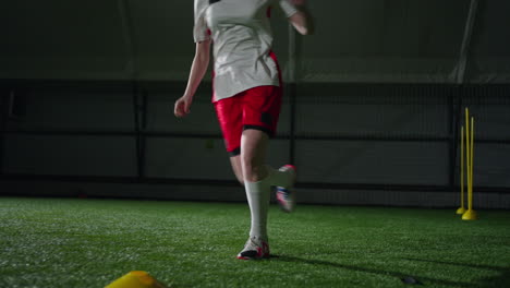 female soccer player training indoors