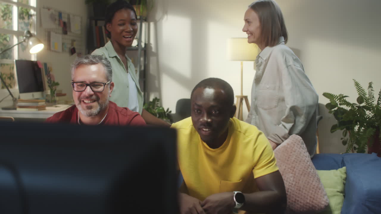 Friends and Family Celebrating and Cheering while Watching TV