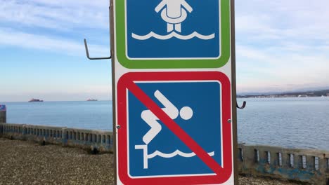 safety signs on an open beach