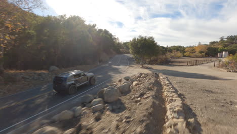 Cinematic-FPV-drone-shot-chasing-a-police-car-along-a-country-road