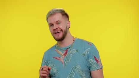 man smiling excitedly, pointing to camera, beauty choosing lucky winner, indicating to awesome you