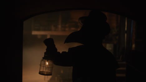 plague doctor silhouette in a dark room
