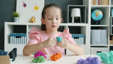 girl playing with play-doh