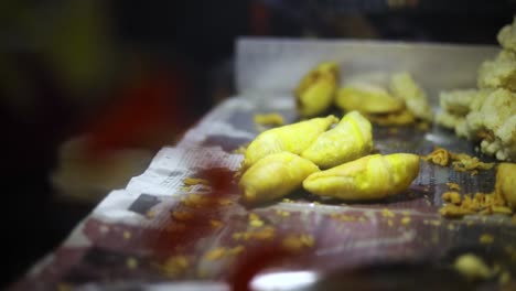 Shot-of-a-street-vendor-cooking-and-selling-their-deep-fried-Indonesian-food-on-the-streets-of-Jakarta