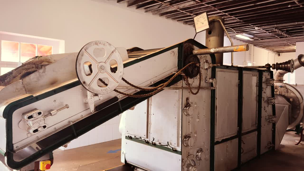 Industrial tea processing machinery and conveyor system inside traditional tea factory Sao Miguel Azores Portugal