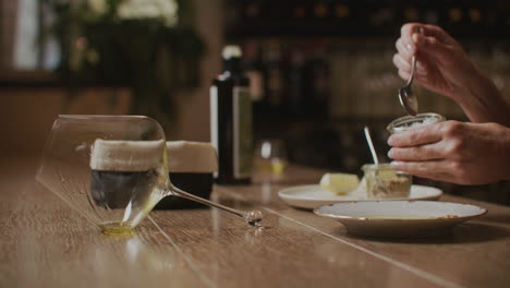 preparing a dish with olive oil and seasoning
