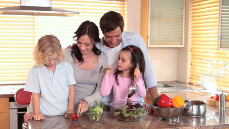 smiling children cooking with their parents