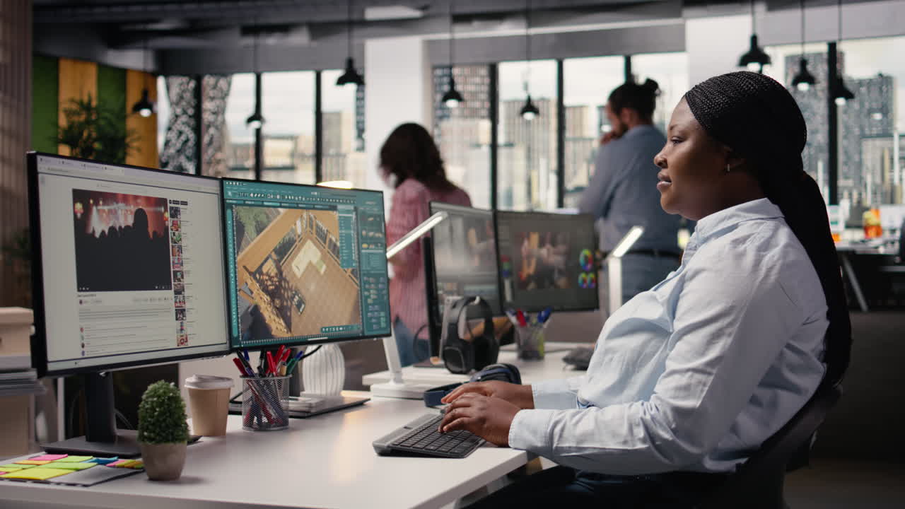 Black designer using architectural software and virtual assets for floor plan