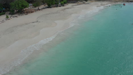 Antigua-and-Bermuda---2023:-tourist-swim-on-clear-turquoise-caribbean-water-on-Antigua-and-Bermuda-coast