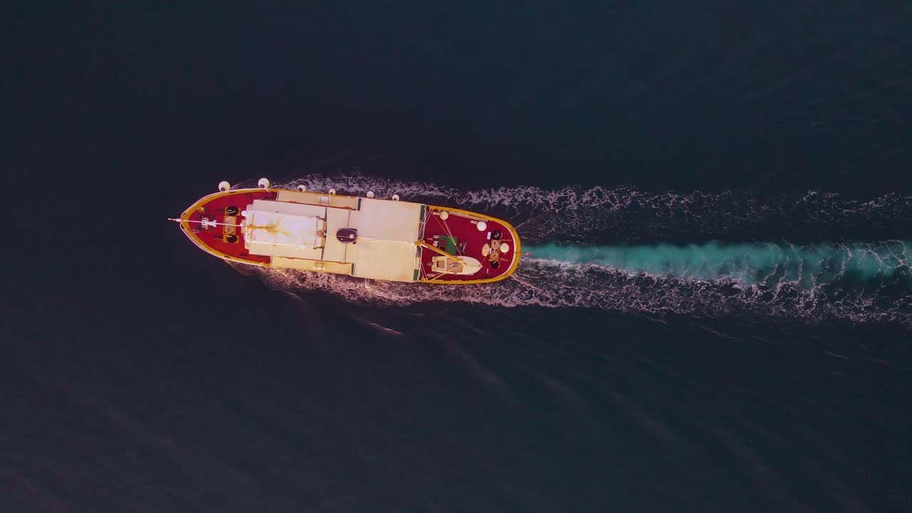 A spectacular maritime journey is beautifully depicted through a drone's perspective, showing a stunning ship traversing the ocean
