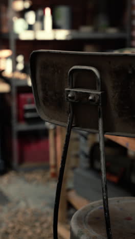 close up of a rusty metal chair back