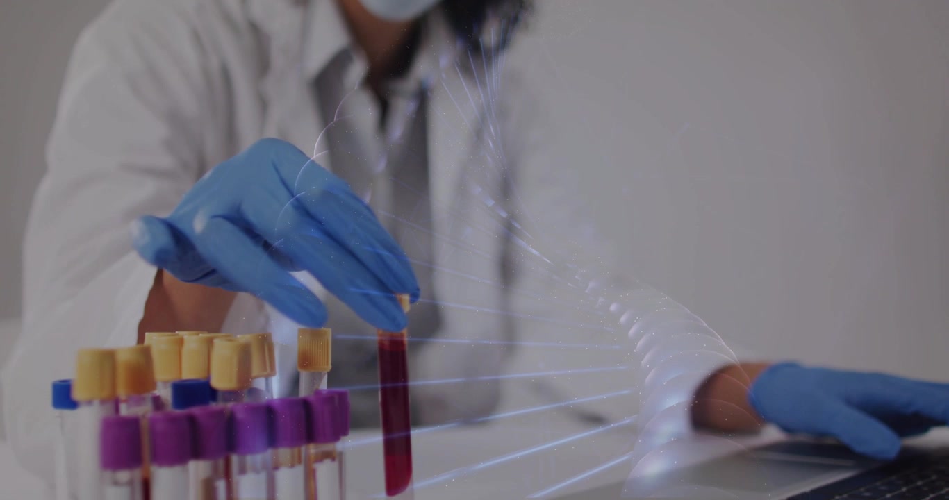 Lab worker holding blood tube, placing into rack, logging sample on laptop while DNA helix overlays