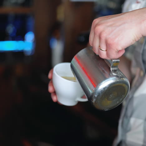 barista drawing the heart on the coffee. concept of services and beverages. sqare video