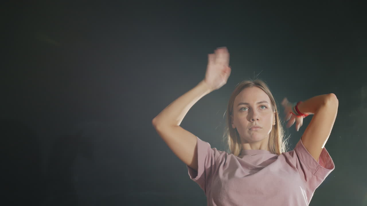 Young Woman Dancing in the Studio