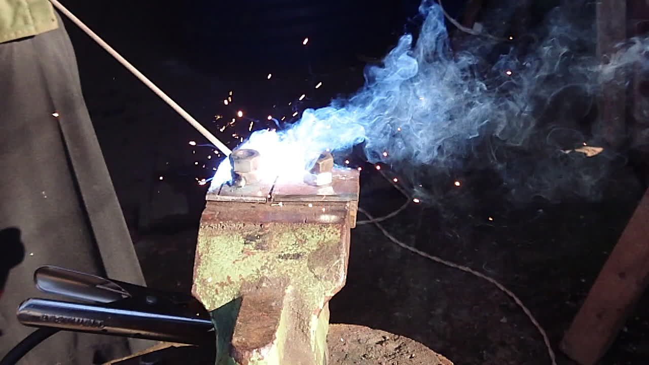 Welding in slowmotion 960fps. Sparkles, fire. metalwork