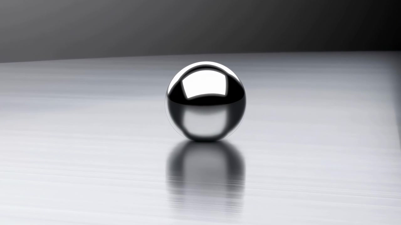 Single polished chrome sphere rests on brushed-metal tabletop, showing bright rectangular highlight on upper curve, soft mirrored reflection below, smooth monochrome studio lighting and minimal