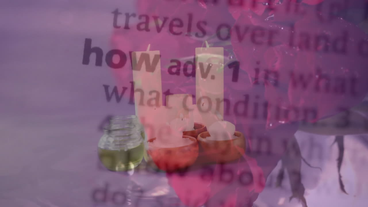Candles and essential oils with dictionary text overlay on pink background