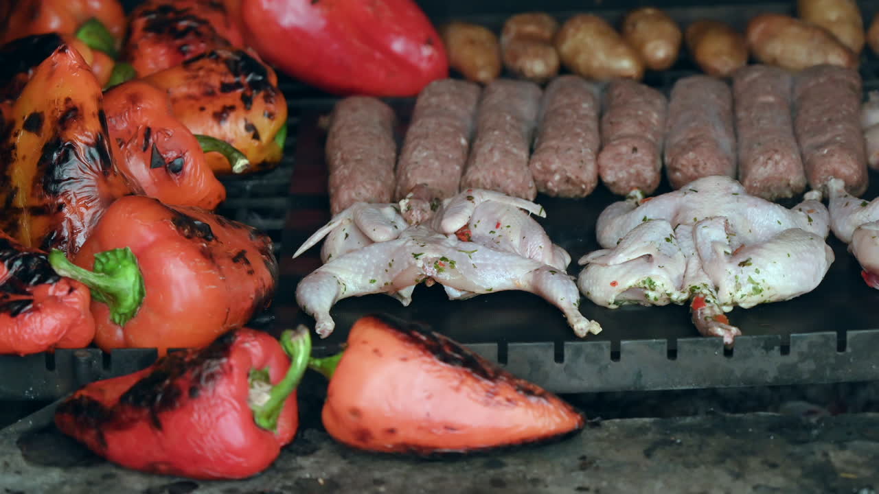 Bbq beef and quail meat on grill with vegetables