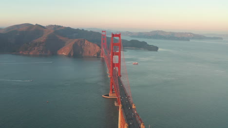 aerial slider shot over the golden gate bridge from the south at sunset