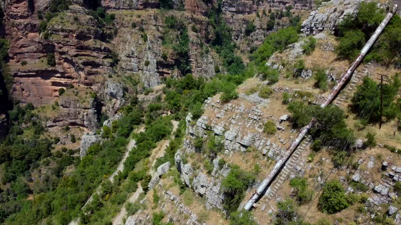 Aerial View of a Village Nestled in a Mountain Canyon