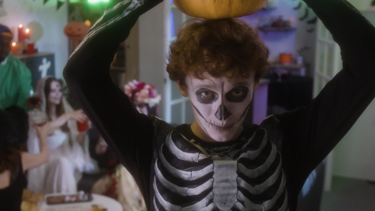 Halloween Party with Skeleton Costume and Pumpkin