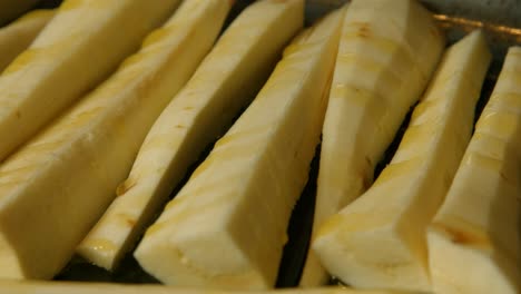 Panning-Shot-of-Parsnips-with-Olive-Oil