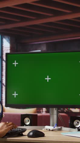 vertical video student at home browsing internet on green screen computer