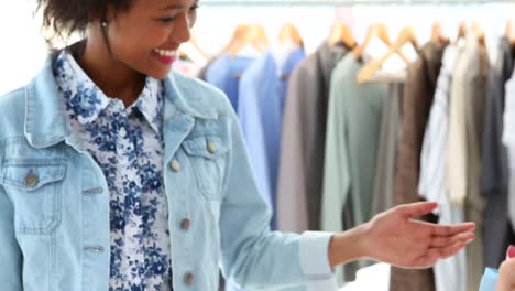 woman paying for her purchases with credit card