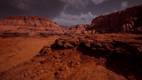 red rock formations under a dramatic sunset sky in the desert