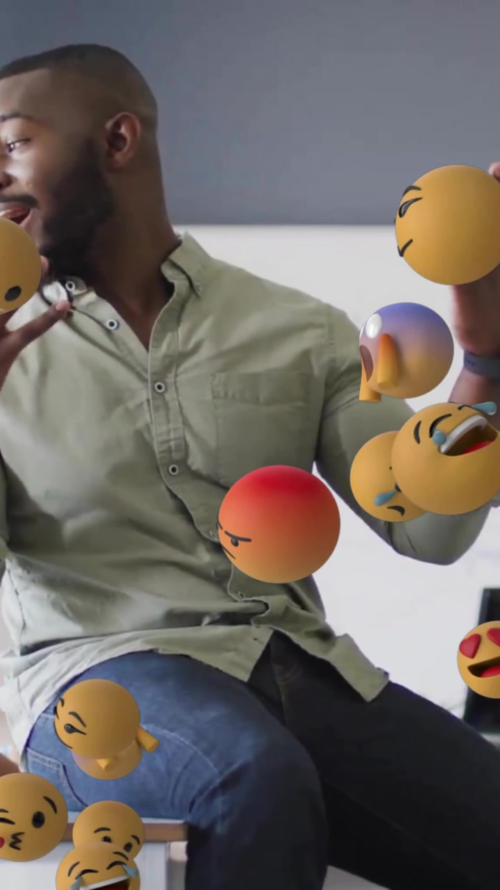 Animation of emoji icons over diverse schoolchildren and teacher