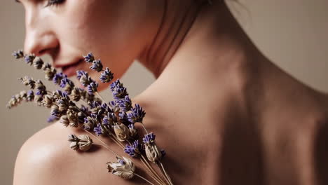 woman's shoulder with lavender flowers
