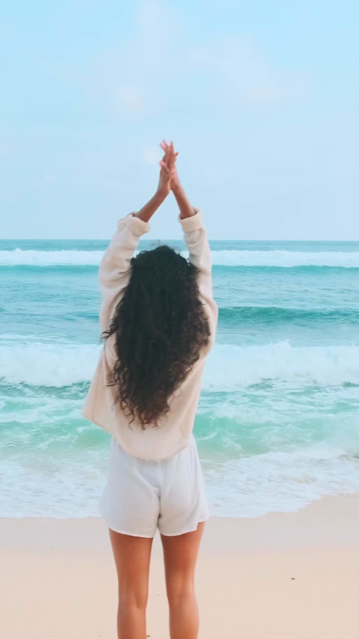 A serene coastal stroll at sunset on a tranquil beach in summer