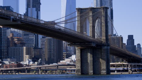 shot of brooklyn bridge with manhattan in background